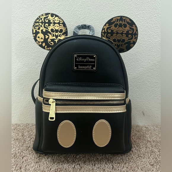 Disney Handbags - NWT Loungefly Disney Mickeys Main Attraction pirates of the Caribbean backpack